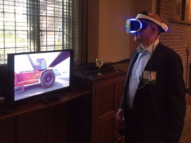 Mike McParlan with APi Group Inc. checking out the virtual reality video at the New Member Reception.