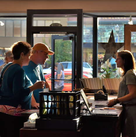 people chatting in a record store