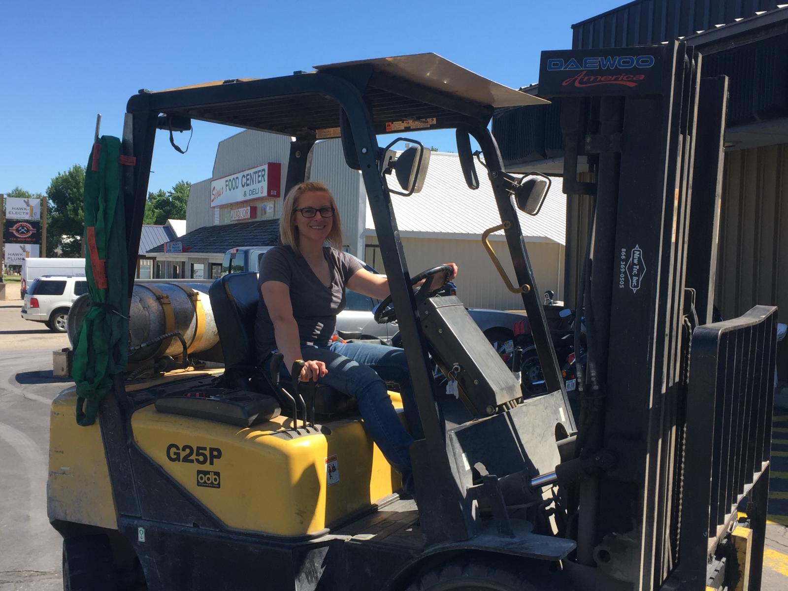 Brittany White operates a fork lift outside Ranco in Sioux Rapids. White, an army veteran, utilized Home Base Iowa to find employment in the region.