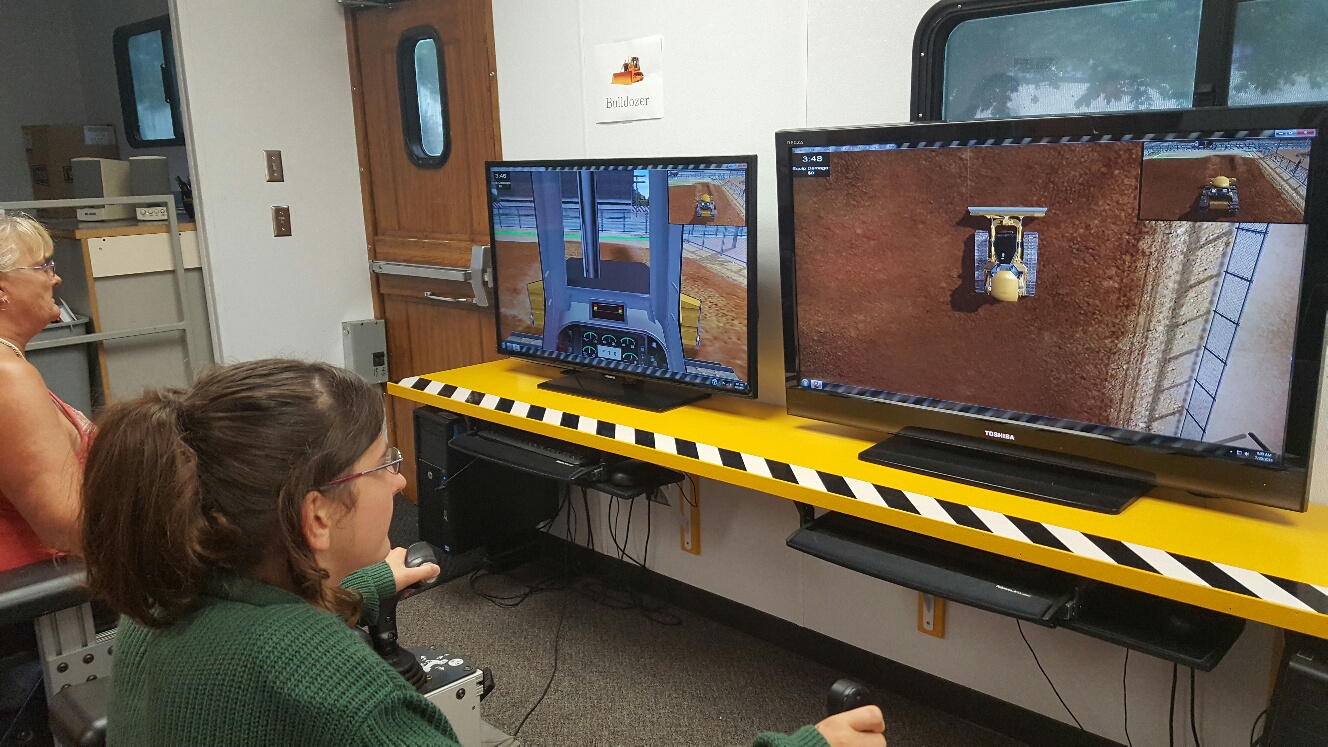 The heavy equipment simulator gave the public a chance to operate different types of construction machinery.