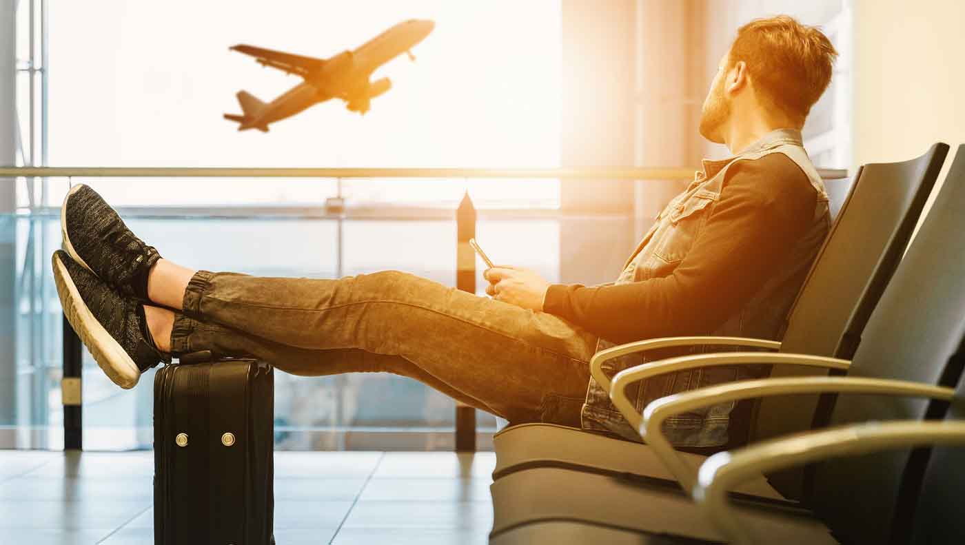 young man waiting at an airport