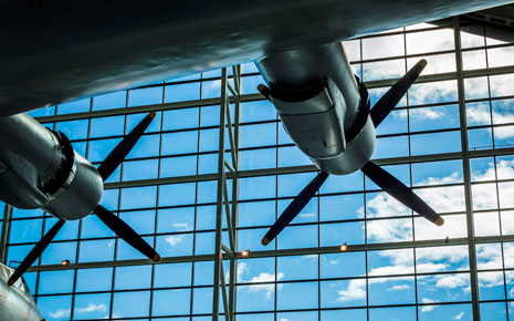 Airplane engine propellers facing a large window