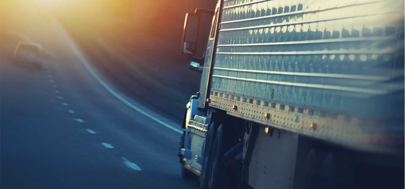 Tractor trailer driving on a freeway