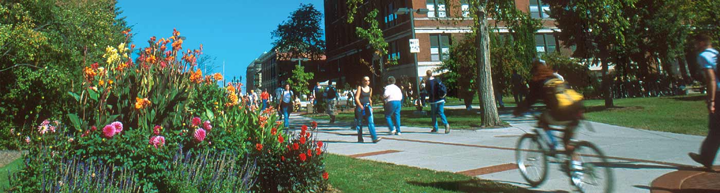 students walking and biking on campus