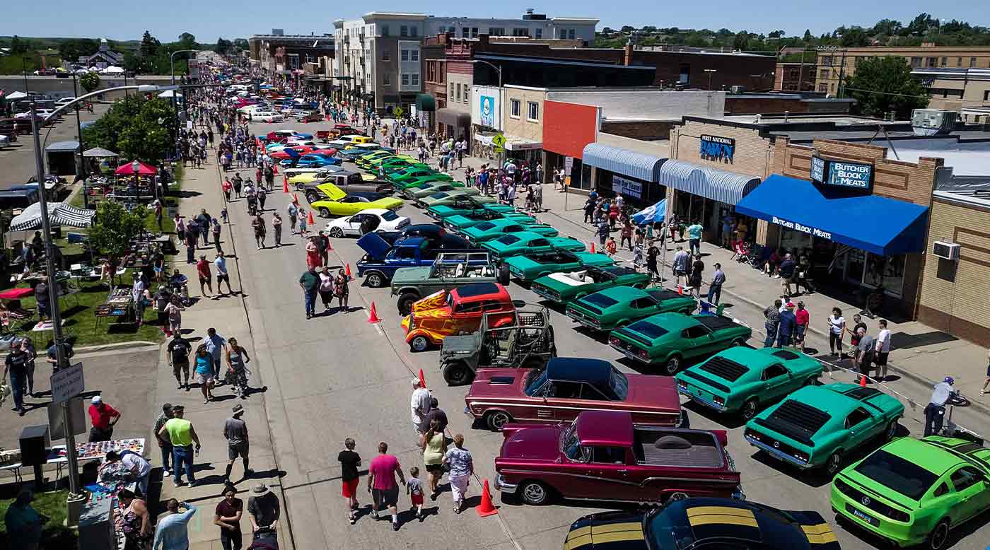 aerial photo of downtown colorful car show